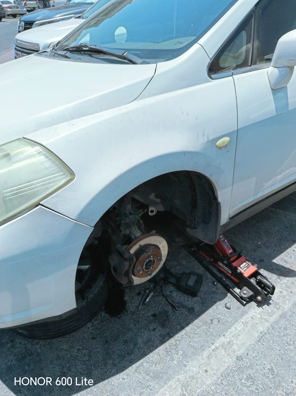 Roadside tyre and brake job on a Mazda CX-9 in Deira